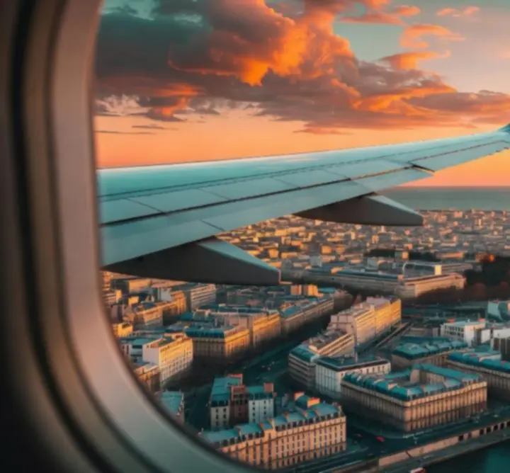 Airplane flying over a famous city landmark